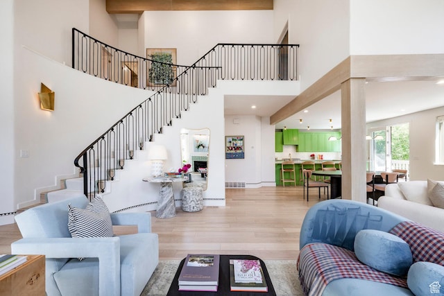 1675 W Silver Springs Rd, Park City, UT 84098 - living room with light wood finished floors, a high ceiling, and stairway
