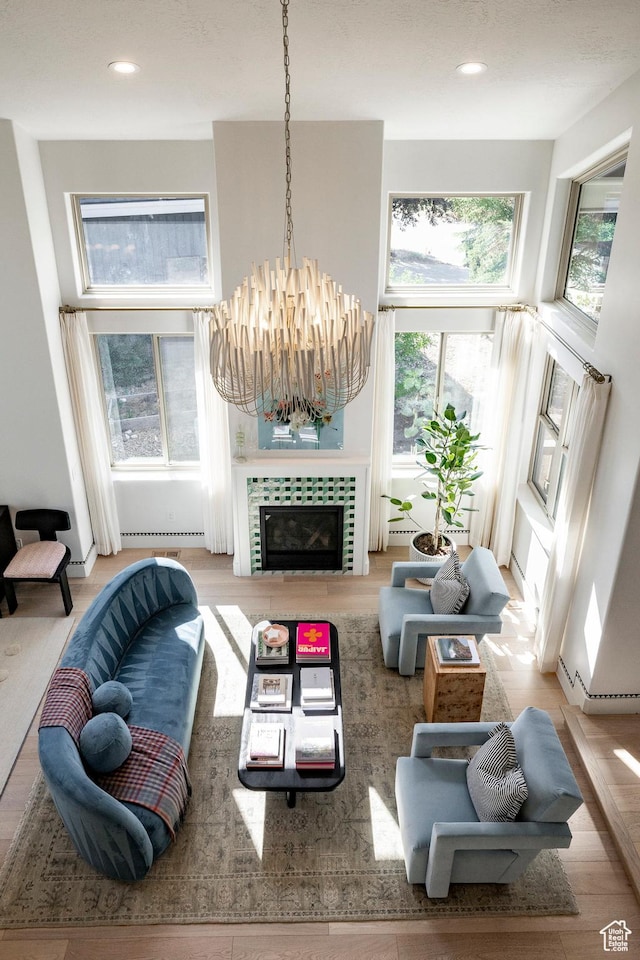 1675 W Silver Springs Rd, Park City, UT 84098 - living area with healthy amount of natural light, baseboard heating, a chandelier, recessed lighting, and wood finished floors