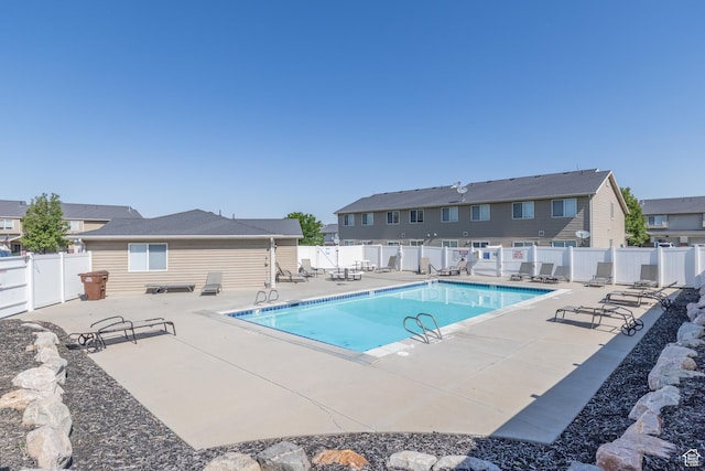 3963 S 2900 W Unit 2B, West Haven, UT 84401 - community pool with a patio, a fenced backyard, and a residential view