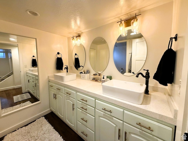 1990 E 400 N, Mapleton, UT 84664 - bathroom with double vanity, wood finished floors, and a textured ceiling