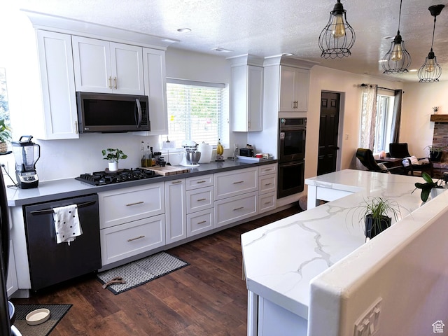 1990 E 400 N, Mapleton, UT 84664 - kitchen featuring black appliances, dark wood-type flooring, white cabinetry, hanging light fixtures, and a textured ceiling