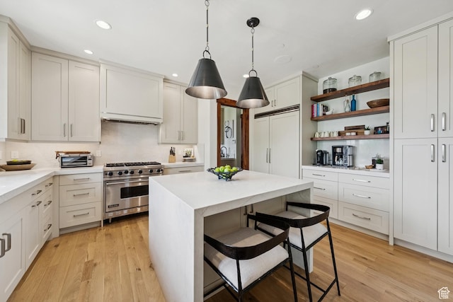 9388 Dye Cabins Dr, Park City, UT 84098 - kitchen with high quality appliances, open shelves, light countertops, recessed lighting, and light wood-style floors