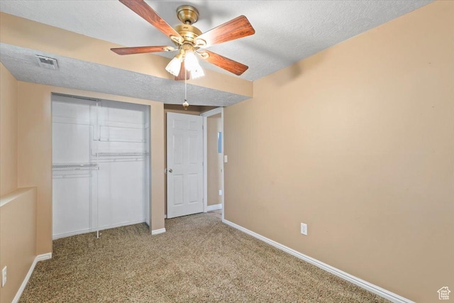 4970 S 4150 W, Roy, UT 84067 - unfurnished bedroom featuring a closet, carpet, a textured ceiling, and a ceiling fan
