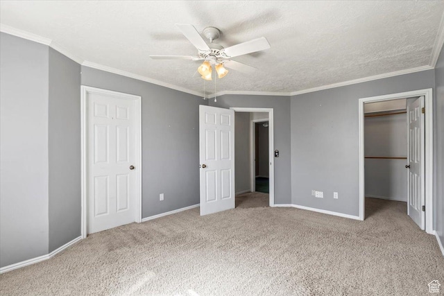 4970 S 4150 W, Roy, UT 84067 - unfurnished bedroom with carpet floors, a walk in closet, crown molding, a ceiling fan, and a textured ceiling