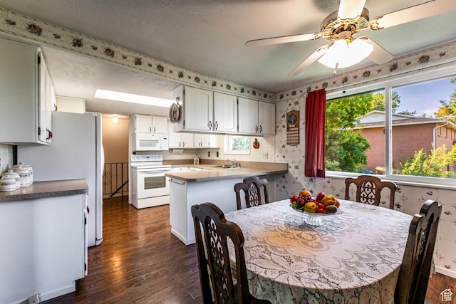 342 E State St, Farmington, UT 84025 - dining room featuring dark wood-style floors, a ceiling fan, and wallpapered walls