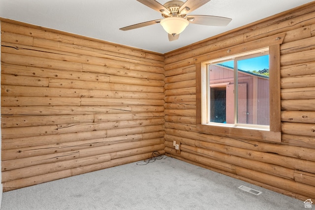 1538 N Mackinaw Way, Garden City, UT 84028 - carpeted empty room featuring rustic walls and a ceiling fan
