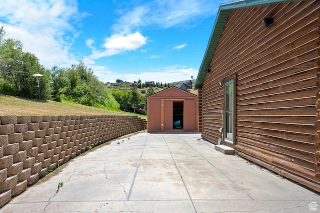 1538 N Mackinaw Way, Garden City, UT 84028 - view of patio / terrace with a storage unit