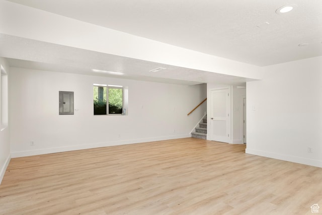 1538 N Mackinaw Way, Garden City, UT 84028 - basement featuring electric panel, stairs, light wood finished floors, and recessed lighting