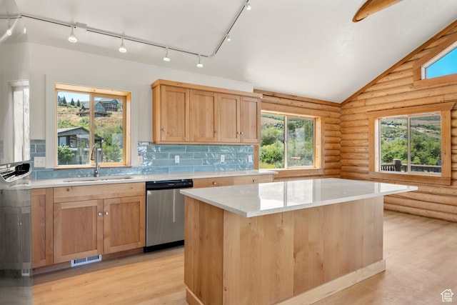 1538 N Mackinaw Way, Garden City, UT 84028 - kitchen featuring dishwasher, rustic walls, light wood finished floors, lofted ceiling, and decorative backsplash