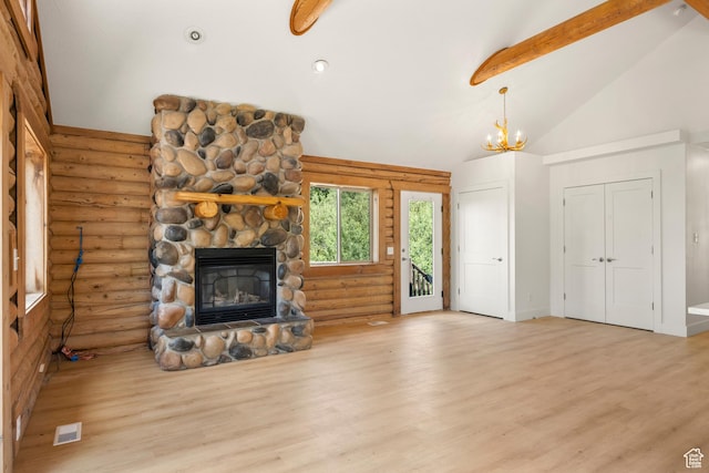 1538 N Mackinaw Way, Garden City, UT 84028 - unfurnished living room featuring rustic walls, wood finished floors, a stone fireplace, high vaulted ceiling, and beamed ceiling