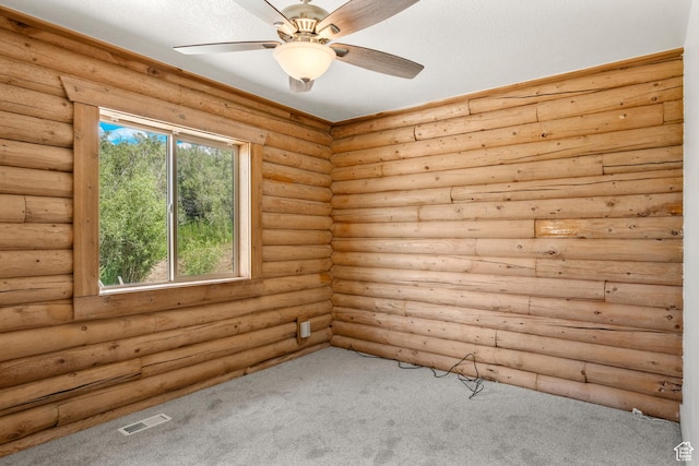 1538 N Mackinaw Way, Garden City, UT 84028 - carpeted spare room featuring a ceiling fan and log walls