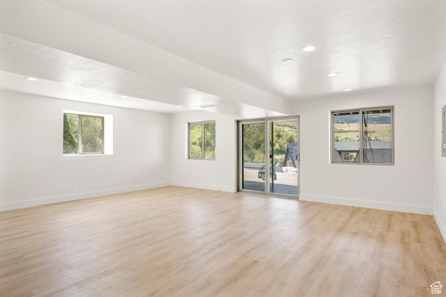 1538 N Mackinaw Way, Garden City, UT 84028 - unfurnished room featuring light wood finished floors, recessed lighting, and a textured ceiling