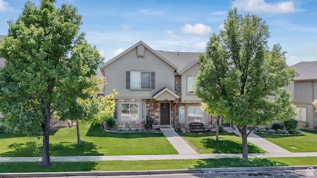 1244 E 800 N Unit 43, Spanish Fork, UT 84660 - view of front of property featuring stone siding, stucco siding, and a front lawn