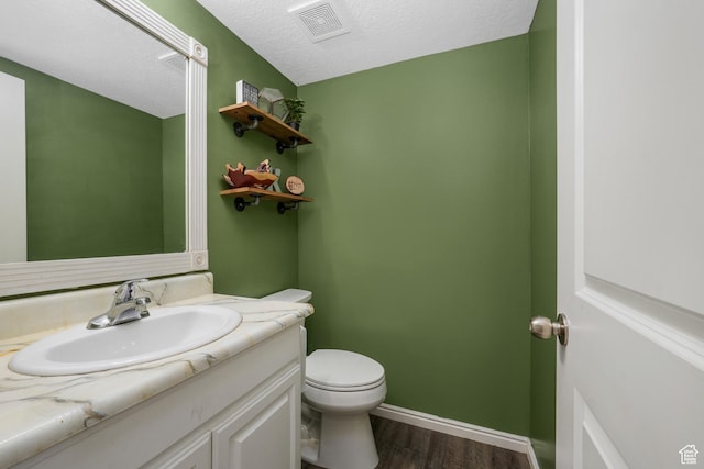 1244 E 800 N Unit 43, Spanish Fork, UT 84660 - half bathroom featuring wood finished floors, vanity, and a textured ceiling