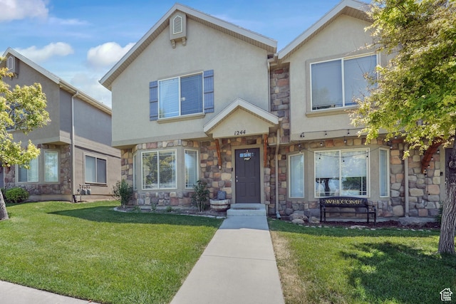 1244 E 800 N Unit 43, Spanish Fork, UT 84660 - view of front of house with stone siding, stucco siding, and a front yard