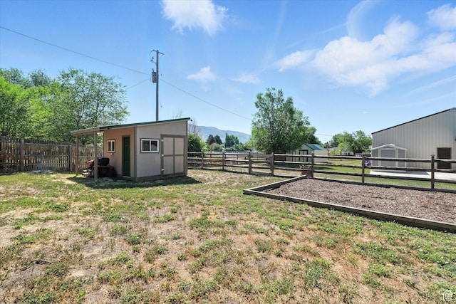 367 W 400 N, Malad City, ID 83252 - fenced backyard featuring a storage unit and a mountain view