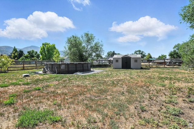367 W 400 N, Malad City, ID 83252 - fenced backyard with a storage shed and a mountain view