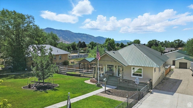 367 W 400 N, Malad City, ID 83252 - view of front facade with driveway, a metal roof, a mountain view, and a detached garage