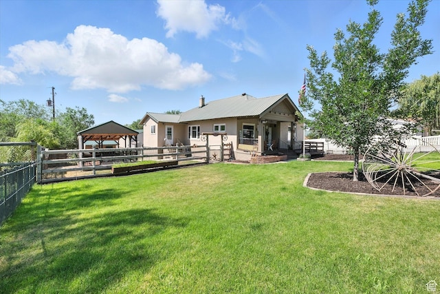 367 W 400 N, Malad City, ID 83252 - back of property with a gazebo, a fenced backyard, a metal roof, and stucco siding