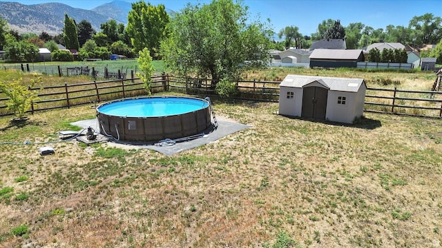 367 W 400 N, Malad City, ID 83252 - fenced backyard featuring a shed and a mountain view