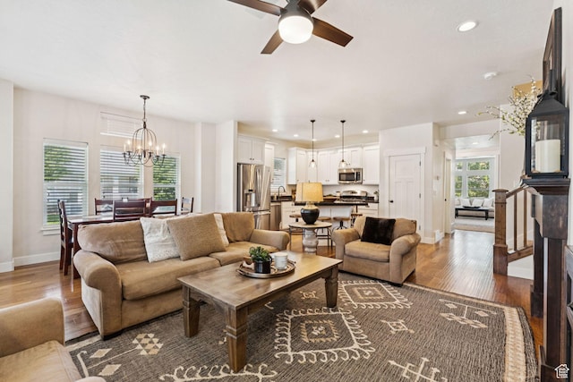 693 S Silver Leaf Dr W, Mapleton, UT 84664 - living room with a chandelier, a ceiling fan, wood finished floors, and recessed lighting
