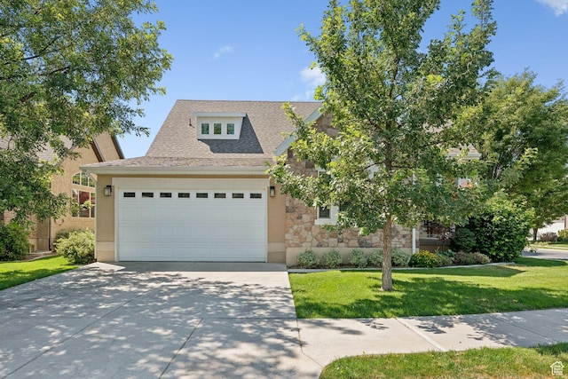 693 S Silver Leaf Dr W, Mapleton, UT 84664 - view of front of property with stone siding, driveway, a garage, a front yard, and a shingled roof