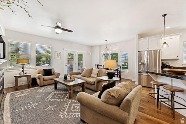 693 S Silver Leaf Dr W, Mapleton, UT 84664 - living area featuring wood finished floors, a chandelier, and ceiling fan