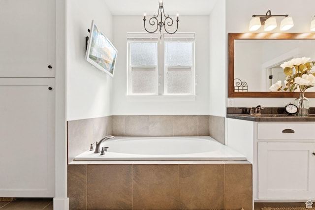 693 S Silver Leaf Dr W, Mapleton, UT 84664 - bathroom with a chandelier, vanity, and a bath