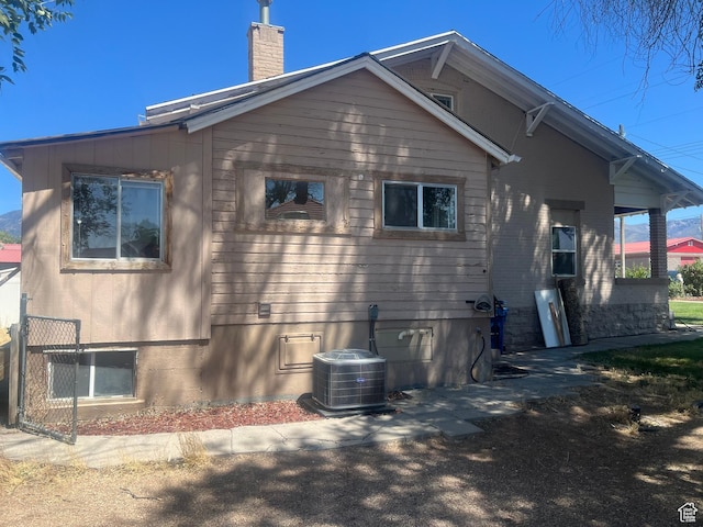 60 W 100th St N, Fillmore, UT 84631 - view of home's exterior featuring a central AC unit and a chimney