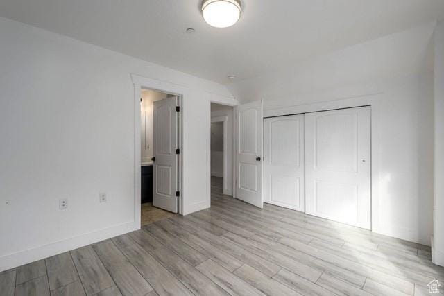 63 E Bridle Villa Dr, Draper, UT 84020 - unfurnished bedroom featuring a closet and light wood finished floors