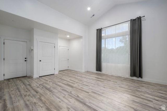 63 E Bridle Villa Dr, Draper, UT 84020 - empty room with wood finished floors, lofted ceiling, and recessed lighting
