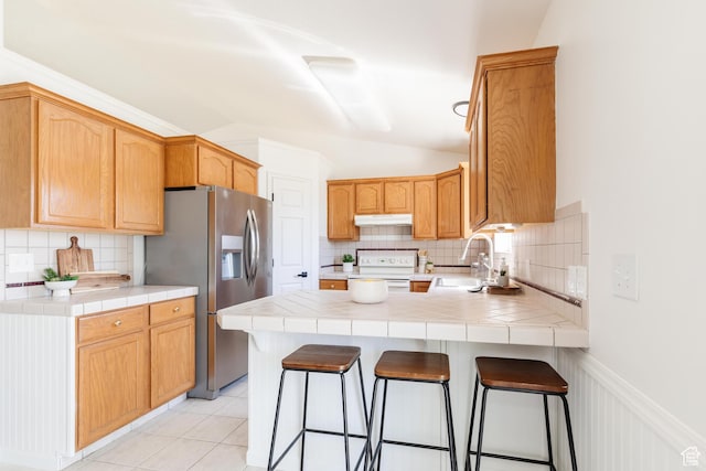 431 S Oakwood Dr W, Logan, UT 84321 - kitchen featuring stainless steel fridge with ice dispenser, under cabinet range hood, a peninsula, white range with electric stovetop, and decorative backsplash