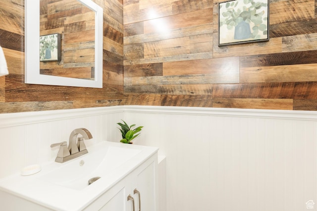 431 S Oakwood Dr W, Logan, UT 84321 - bathroom with vanity, a wainscoted wall, and wooden walls