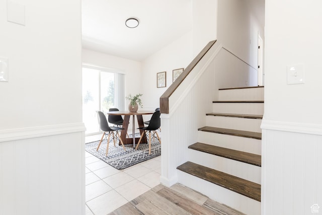 431 S Oakwood Dr W, Logan, UT 84321 - staircase featuring wainscoting and tile patterned floors