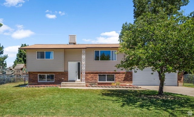 5062 S 2875 W, Roy, UT 84067 - raised ranch featuring brick siding, driveway, and a garage