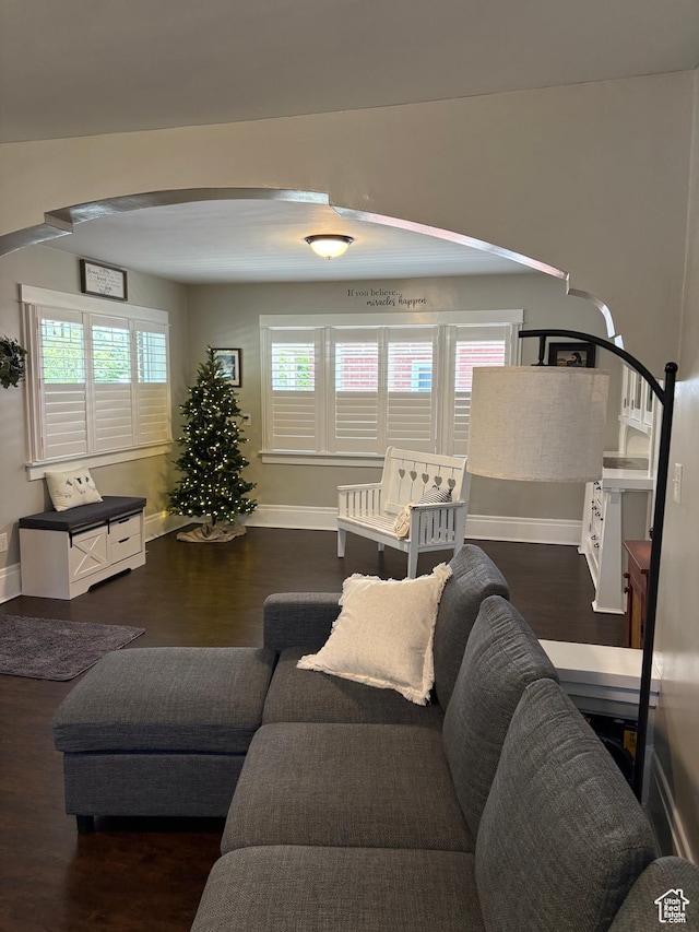 2044 Madison Ave, Ogden, UT 84401 - living room featuring arched walkways and wood finished floors