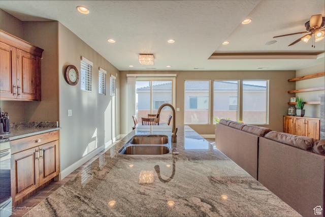 3429 W 175 N, Hurricane, UT 84737 - kitchen with light stone counters, recessed lighting, ceiling fan, open floor plan, and dark wood finished floors