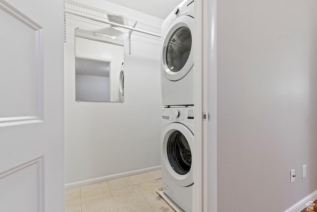 650 N 300 W Unit 229, Salt Lake City, UT 84103 - washroom featuring stacked washer / dryer and baseboards