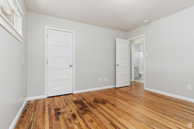 650 N 300 W Unit 229, Salt Lake City, UT 84103 - unfurnished bedroom featuring light wood-type flooring and baseboards