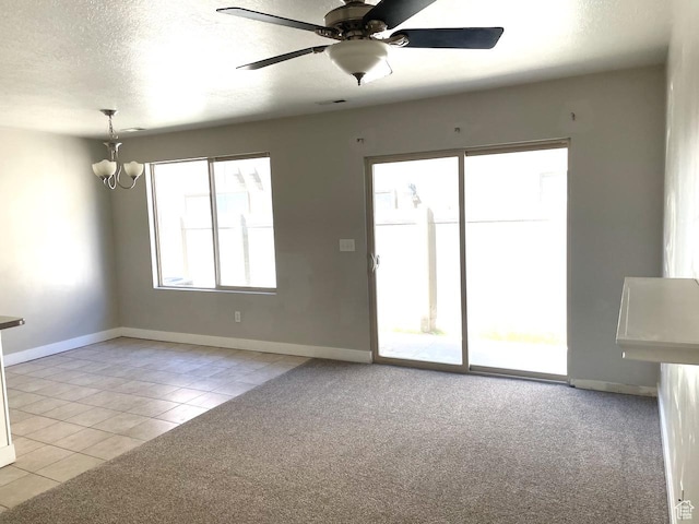 2126 W Fernside St, West Haven, UT 84401 - unfurnished room featuring a chandelier, light tile patterned floors, light carpet, a ceiling fan, and a textured ceiling
