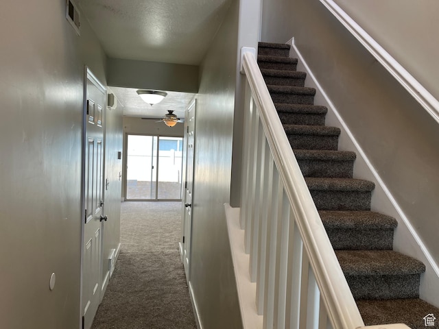 2126 W Fernside St, West Haven, UT 84401 - stairway with carpet floors, a textured ceiling, and ceiling fan