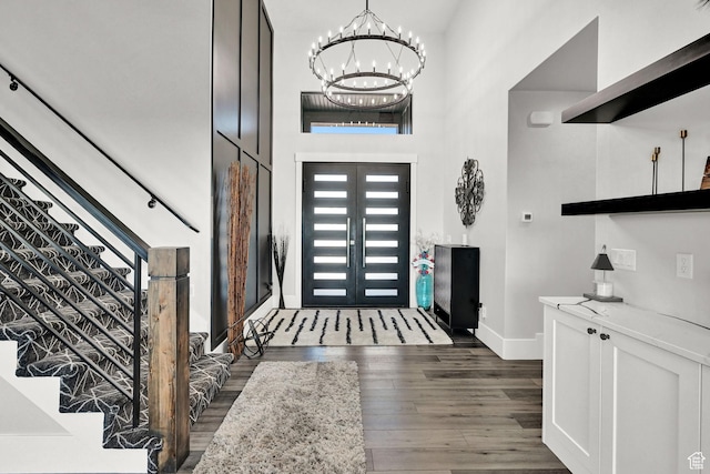 2673 S 4950 W, Taylor, UT 84401 - entryway with a chandelier, wood finished floors, stairs, and a towering ceiling