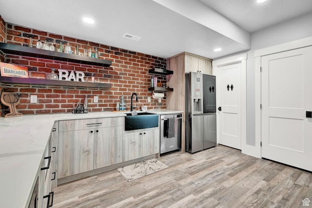 2673 S 4950 W, Taylor, UT 84401 - kitchen with open shelves, stainless steel appliances, light wood-type flooring, recessed lighting, and light stone counters
