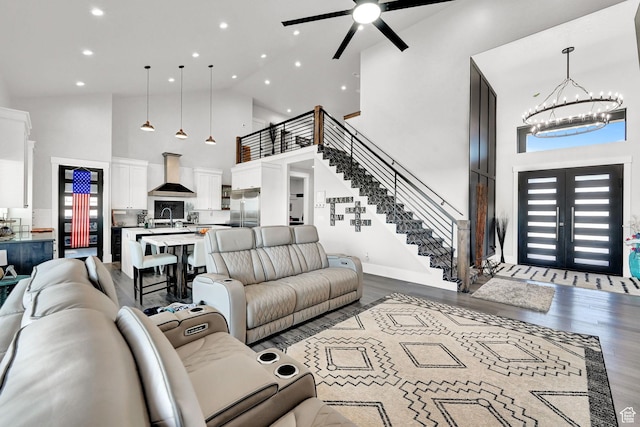 2673 S 4950 W, Taylor, UT 84401 - living area featuring high vaulted ceiling, recessed lighting, a chandelier, a ceiling fan, and wood finished floors