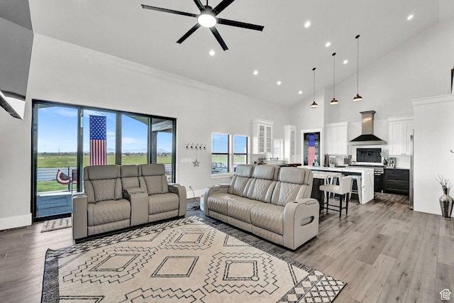 2673 S 4950 W, Taylor, UT 84401 - living area with a ceiling fan, light wood-style floors, a towering ceiling, and recessed lighting