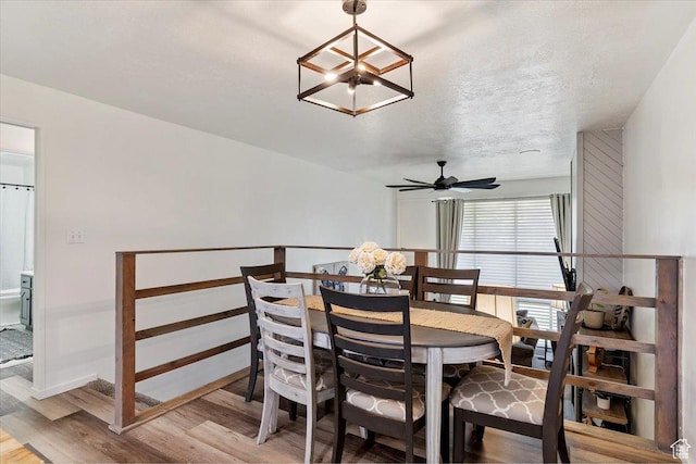 5659 Woodshire Ct, South Ogden, UT 84403 - dining space with light wood-style flooring, a chandelier, and ceiling fan