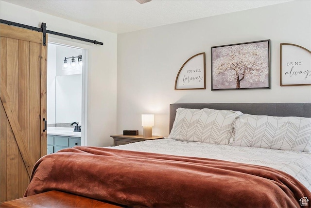 5659 Woodshire Ct, South Ogden, UT 84403 - bedroom featuring a barn door and connected bathroom