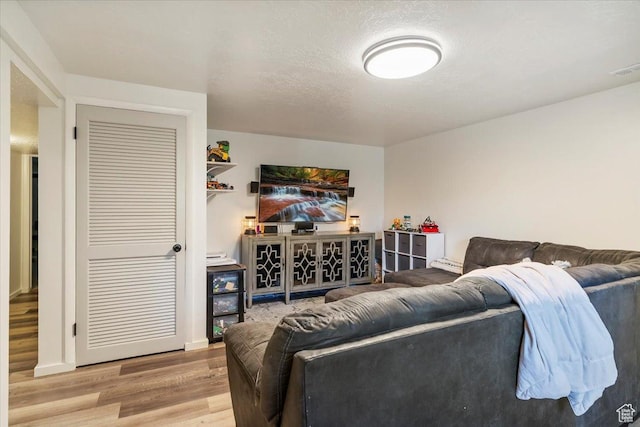 5659 Woodshire Ct, South Ogden, UT 84403 - living room with wood finished floors and a textured ceiling