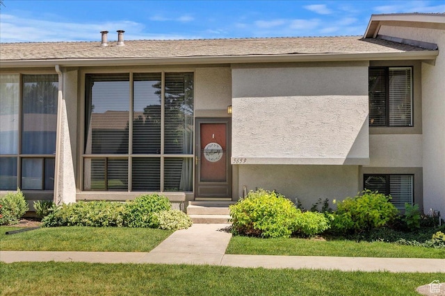 5659 Woodshire Ct, South Ogden, UT 84403 - view of front facade with stucco siding