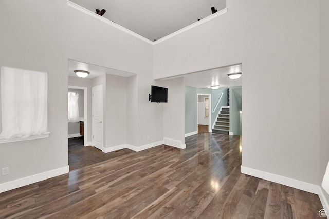 797 E 10 S, American Fork, UT 84003 - unfurnished room with stairs, crown molding, wood finished floors, and a towering ceiling